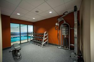 a room with a swimming pool and a gym at Hampton Inn Fort Morgan in Fort Morgan