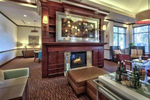a lobby with a fireplace in a hotel room at Hilton Garden Inn Albuquerque Uptown in Albuquerque