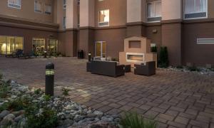 a courtyard with a fireplace in front of a building at Hampton Inn & Suites - Reno West, NV in Reno