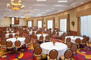 a large room with tables and chairs in it at DoubleTree by Hilton Jefferson City in Jefferson City