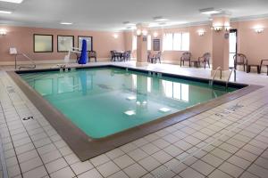 a large swimming pool in a hotel room at Hampton Inn Portage in Portage