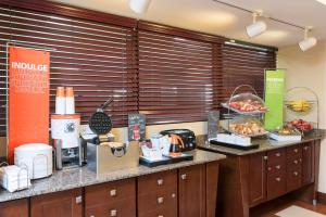 a kitchen with a counter with some food on it at Hampton Inn Port Huron in Port Huron