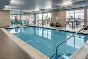 a large pool with blue water in a hotel room at Home2 Suites By Hilton Dayton Centerville in Centerville