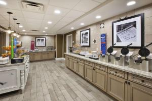 a large room with a buffetasteryasteryasteryasteryasteryasteryasteryasteryasteryastery at Hampton Inn & Suites Alliance in Alliance