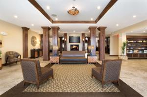 a lobby with a couch and a fireplace at Homewood Suites by Hilton Newport-Middletown in Middletown