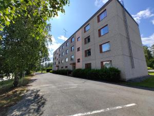 a building on the side of a road at New 1 bedroom apartment near amenities nilsia near tahko in Nilsiä