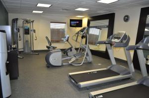 a gym with treadmills and machines in a room at Hampton Inn Pleasanton in Pleasanton
