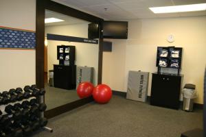 a gym with two red balls and weights at Hampton Inn La Junta in La Junta