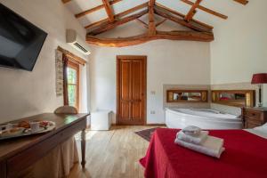 A bed or beds in a room at Corte Cristina & Suites