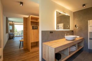 a bathroom with a sink and a mirror at Natur Residence Kaiser Hans in Schenna