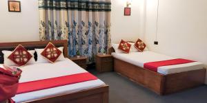 A bed or beds in a room at Atithi Griha Homestay - ARITAR, SILK ROUTE, SIKKIM
