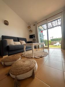 a living room with a couch and a table at Sa Caseta d'Artrutx in Cala'n Bosch