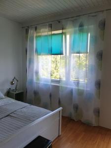 Posteľ alebo postele v izbe v ubytovaní Ferienwohnung mit Pool an der Apfelstraße