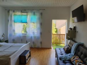 Posteľ alebo postele v izbe v ubytovaní Ferienwohnung mit Pool an der Apfelstraße