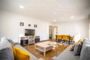 a living room with a couch and a table at Casa Palau in Morella