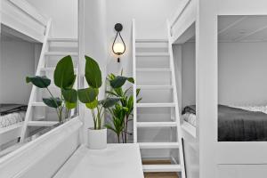 a room with white shelves and a staircase with plants at River View, Balcony, Germantown, Central, Elevator in Nashville
