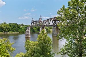 a bridge over a river with trees at River View, Balcony, Germantown, Central, Elevator in Nashville