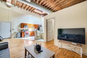 a living room with a couch and a table at Central Chicago Loft Walk to Soldier Field! in Chicago