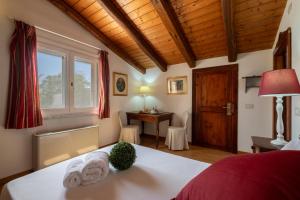 A bed or beds in a room at Corte Cristina & Suites