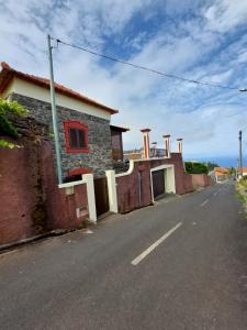 a house on the side of a street at Casa Franco in Ponta do Pargo
