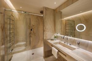 a bathroom with a shower and a sink at Hotel Dei Cavalieri Milano Duomo in Milan