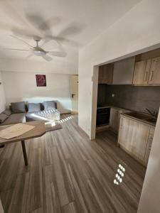 a living room with a couch and a table at Hôtel à la croix d'or in Sessenheim +14 photos