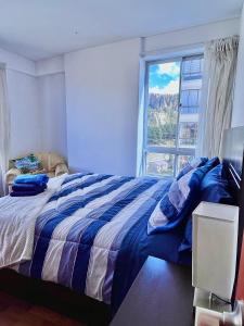 Postel nebo postele na pokoji v ubytování Vista a las montañas y Calefaccion cerca de teleferico y U Catolica + 60 fotografií