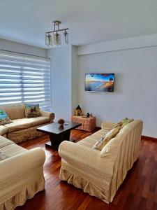 Posezení v ubytování Vista a las montañas y Calefaccion cerca de teleferico y U Catolica