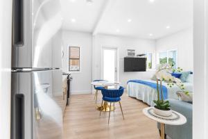 a kitchen and a bedroom with a bed and a table at 316 Seascape Unit 2 in Hollywood
