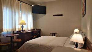 A bed or beds in a room at Lima Wasi Hotel Miraflores