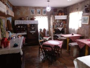 a restaurant with tables and chairs in a room at Pousada Paraíso São thome in São Thomé das Letras +103 photos