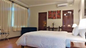 A bed or beds in a room at Lima Wasi Hotel Miraflores