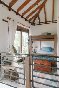 a bedroom with a bunk bed and a balcony at Casa Dino en Villa de Leyva in Villa de Leyva