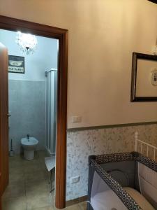 a bathroom with a shower and a toilet and a sink at Casa Varenne in Stropino