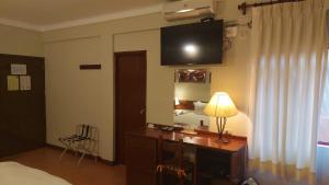 A television and/or entertainment centre at Lima Wasi Hotel Miraflores