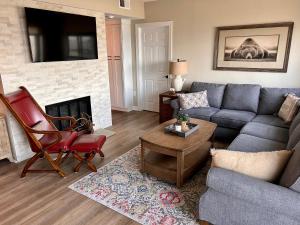 a living room with a couch and a fireplace at On top of the world at Sugar Top Resort in Sugar Mountain +38 photos