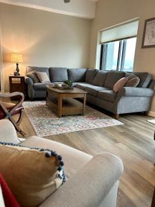 a living room with two couches and a coffee table at On top of the world at Sugar Top Resort in Sugar Mountain