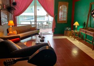 a living room with a couch and a table at My Lovely Loft Beach RG3 in Puerto Vallarta