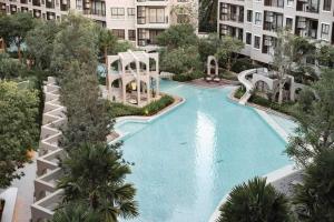 an overhead view of a swimming pool in a apartment building at Lacasita Luxury ( 619 ) Near Huahin Beach in Hua Hin