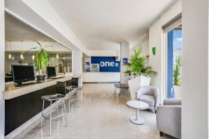 TV a/nebo společenská místnost v ubytování One Guadalajara Periferico Norte