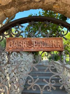 a metal gate with a sign that reads pasta pendulum at Casa Paolina - casa vacanze in Capri