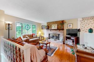 a living room with a couch and a fireplace at Dutch Treat in Lake Junaluska