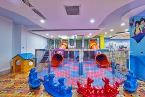 a play room with a bunch of playground equipment at Orange County Alanya Family Only in Alanya