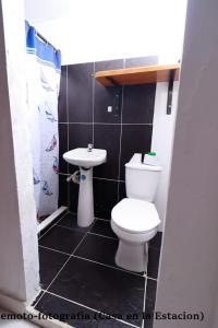 a small bathroom with a toilet and a sink at casa en la estación cocornà in Puerto Triunfo