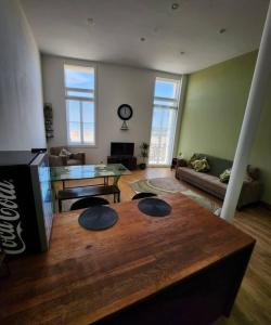 a living room with a table and a couch at Imperial House Sea View Margate in Kent