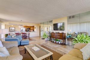 a living room with two couches and a kitchen at Treasure Island Resort Condo with Beach Access! in St Pete Beach