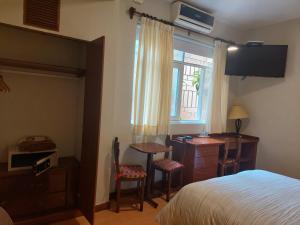 A bed or beds in a room at Lima Wasi Hotel Miraflores