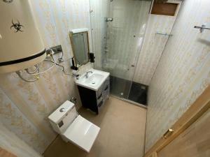a small bathroom with a sink and a mirror at Luxury Egypt Group of House Boat in Srinagar +28 photos