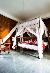 a bedroom with two bunk beds with a mosquito net at Ella Rock Glance in Ella