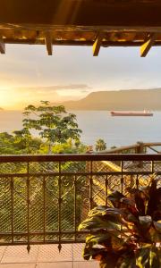 a view of the ocean from a balcony at Mooi Guest House in Ilhabela